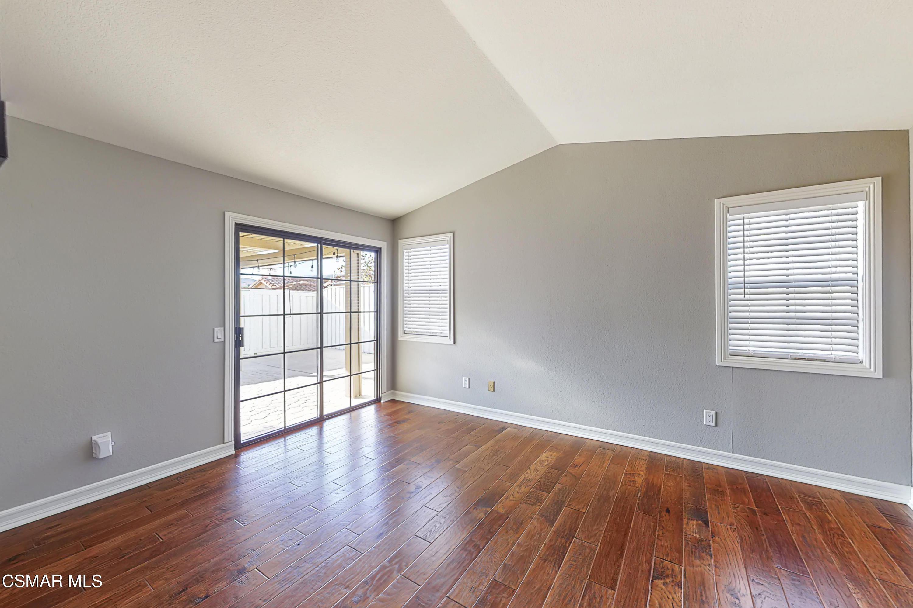 657 Cartpath Place Simi Valley, CA 93065 - Photo 13 of 50 an empty room with wooden floor and windows