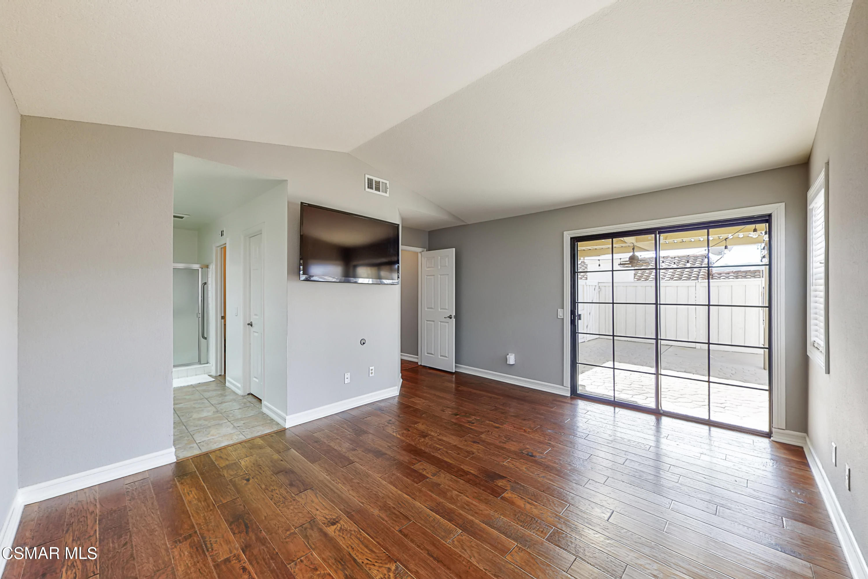 657 Cartpath Place Simi Valley, CA 93065 - Photo 14 of 50 an empty room with wooden floor and windows