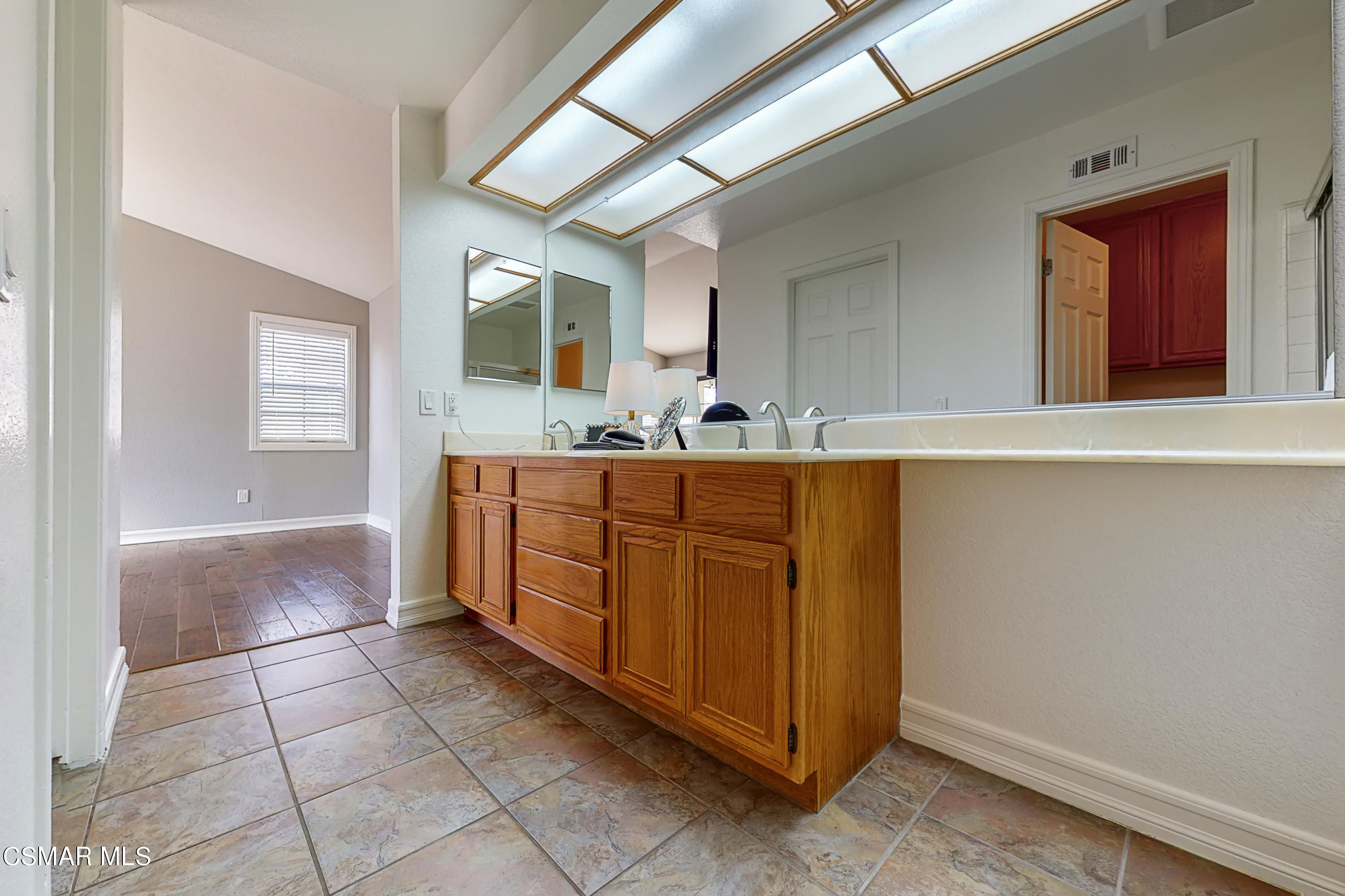 657 Cartpath Place Simi Valley, CA 93065 - Photo 15 of 50 a bathroom with a sink vanity and mirror
