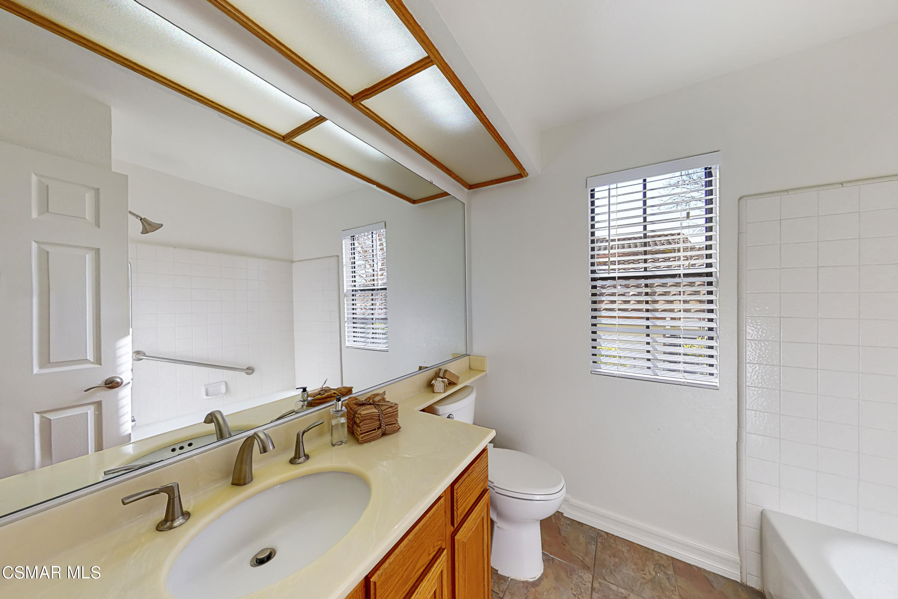 657 Cartpath Place Simi Valley, CA 93065 - Photo 29 of 50 a bathroom with a sink and a mirror