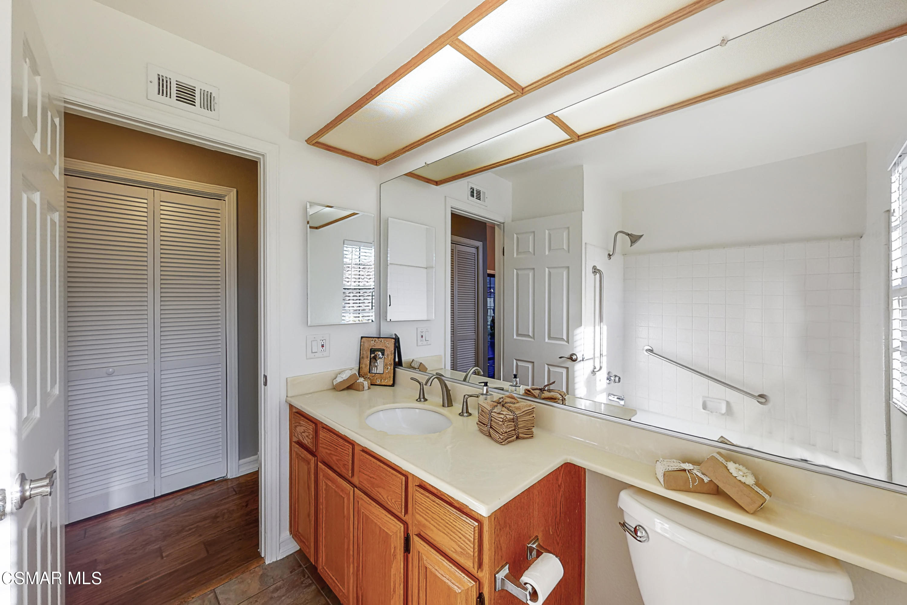 657 Cartpath Place Simi Valley, CA 93065 - Photo 30 of 50 a bathroom with a sink and a mirror
