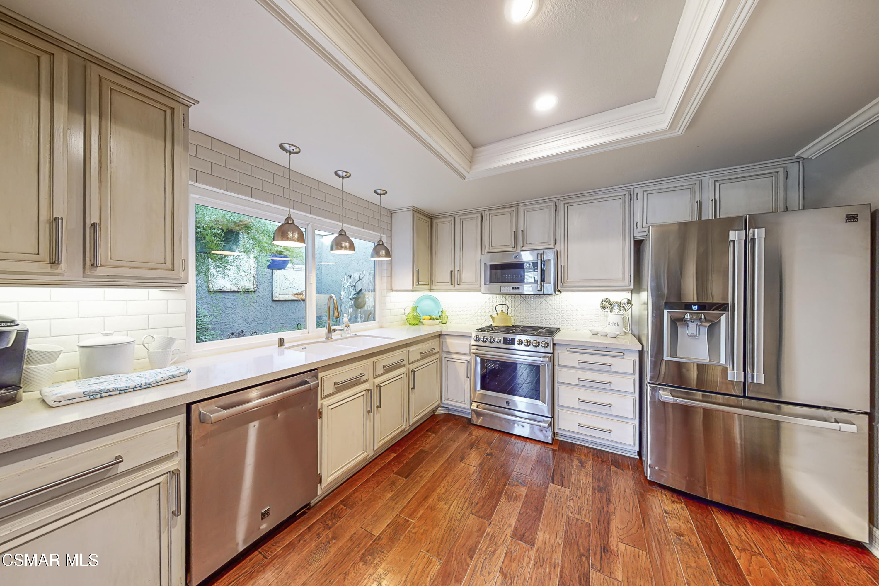 657 Cartpath Place Simi Valley, CA 93065 - Photo 4 of 50 a kitchen with granite countertop stainless steel appliances a refrigerator sink and cabinets