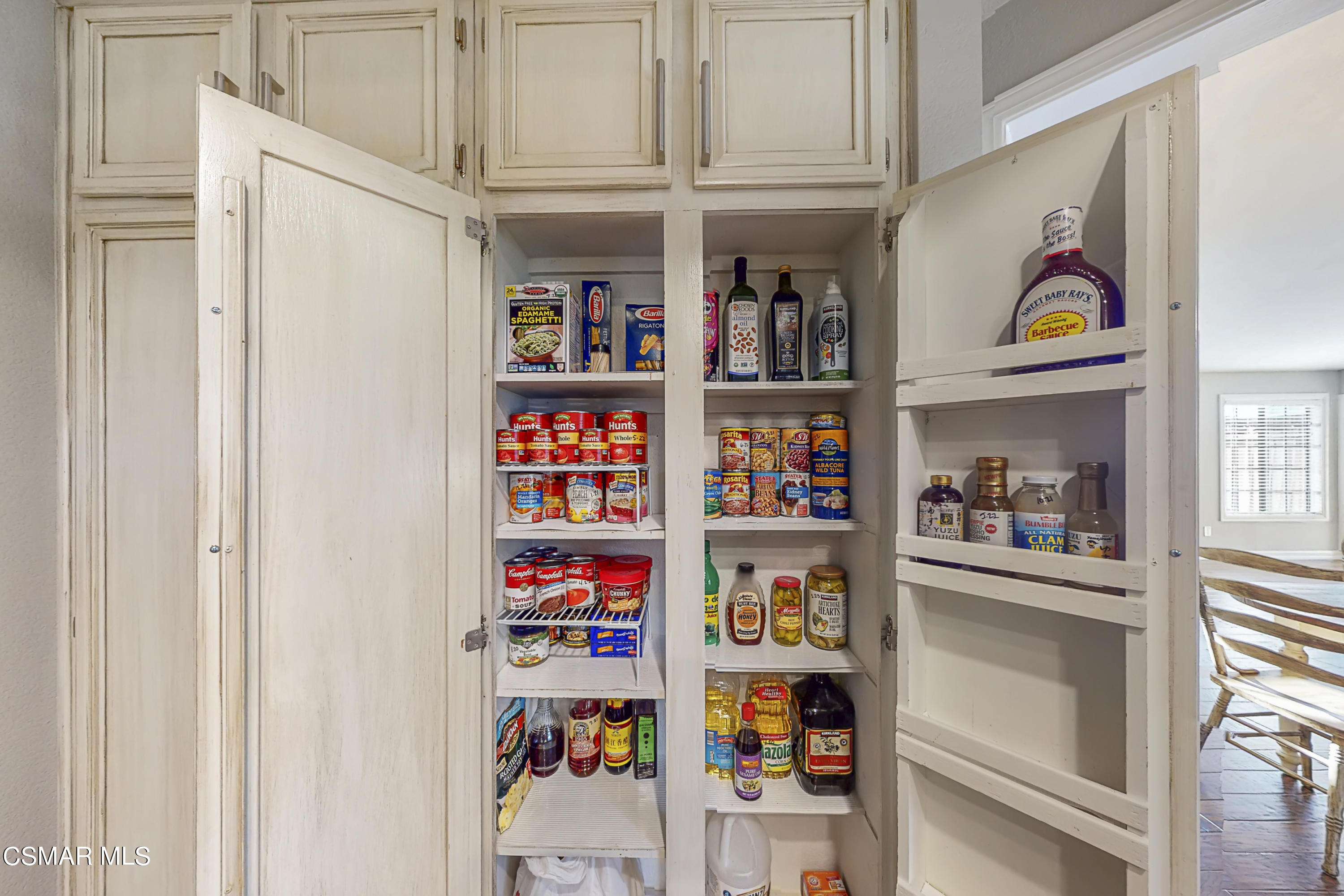 657 Cartpath Place Simi Valley, CA 93065 - Photo 32 of 50 a book shelf with books and knick knacks on it