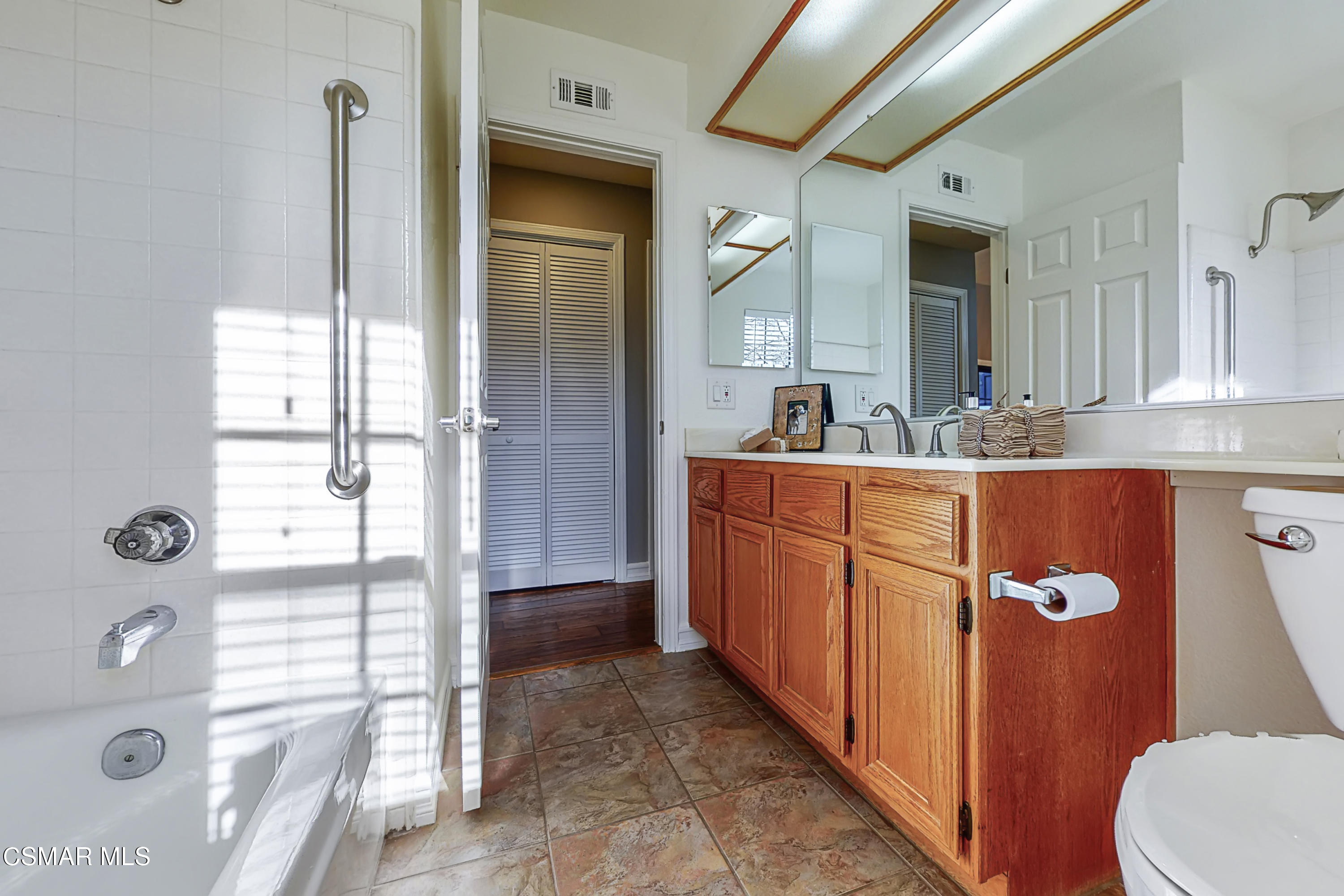657 Cartpath Place Simi Valley, CA 93065 - Photo 37 of 50 a bathroom with a double vanity sink and mirror