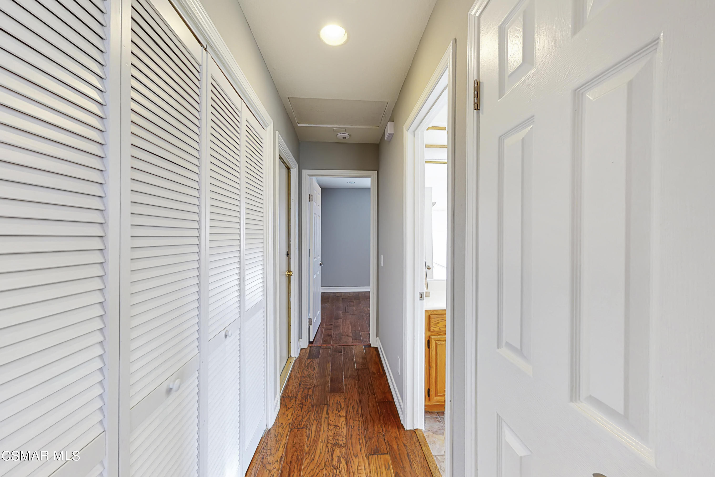 657 Cartpath Place Simi Valley, CA 93065 - Photo 41 of 50 a view of a hallway with wooden floor and staircase