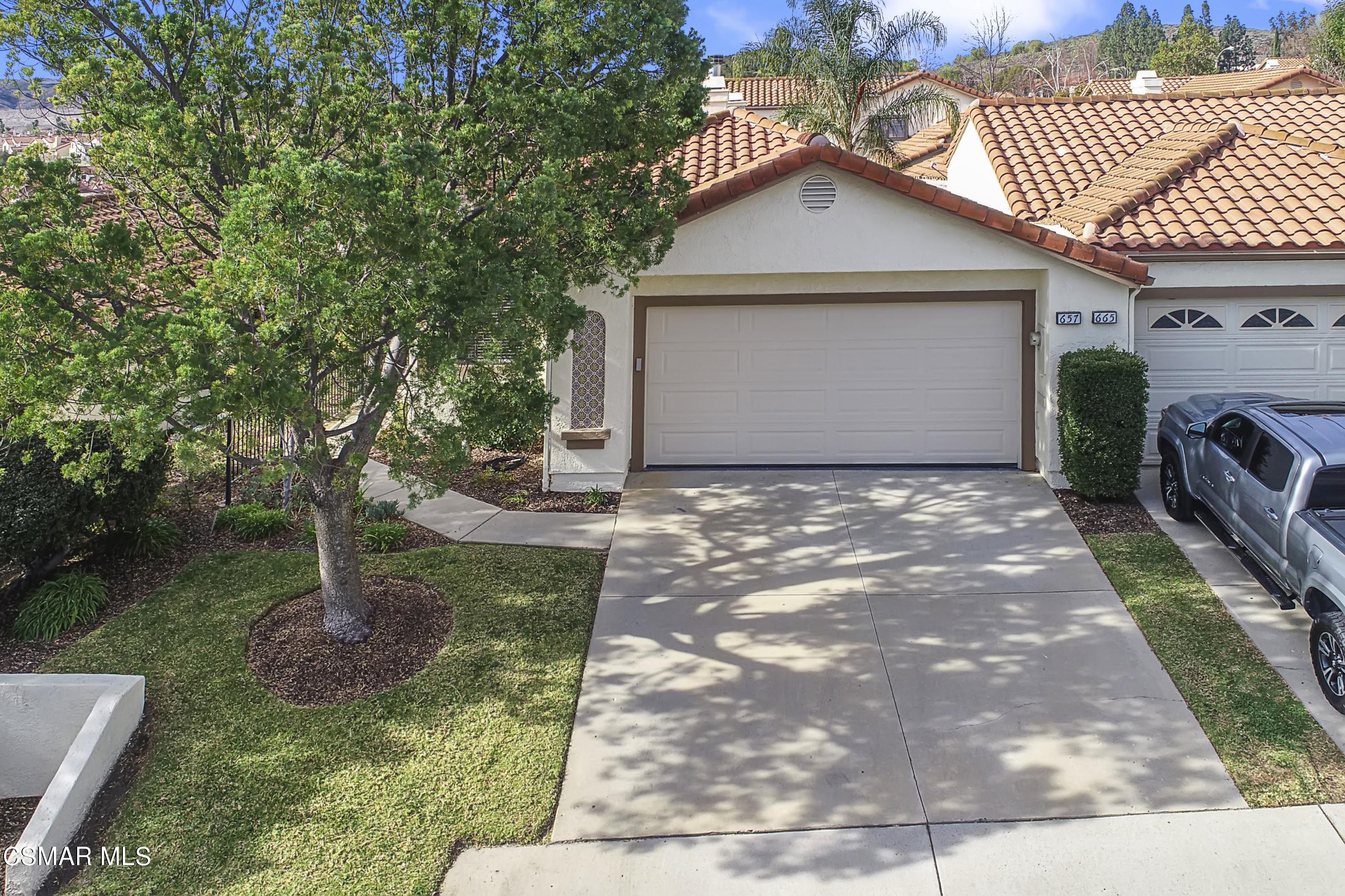 657 Cartpath Place Simi Valley, CA 93065 - Photo 44 of 50 a front view of a house with garden
