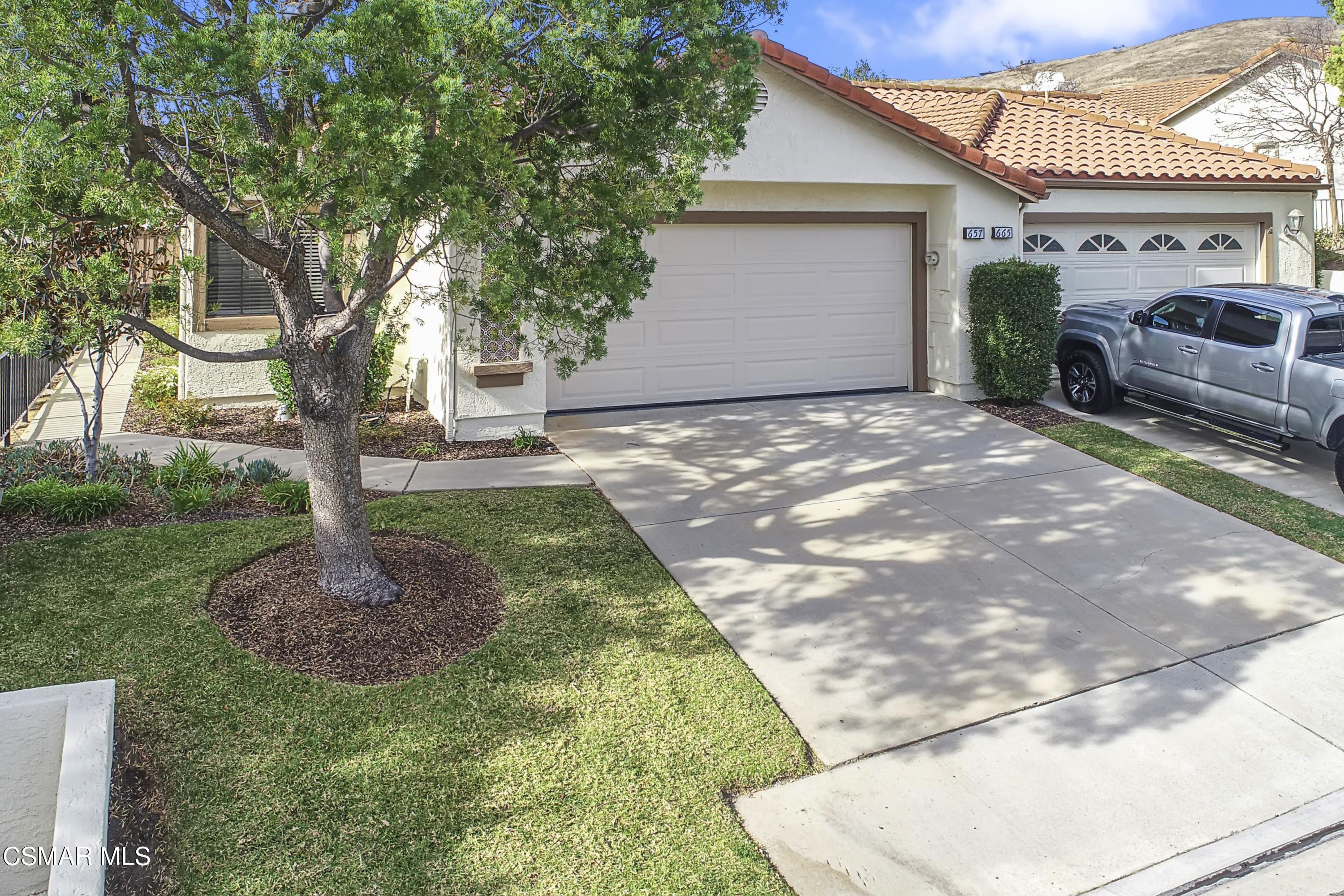 657 Cartpath Place Simi Valley, CA 93065 - Photo 45 of 50 a front view of a house with garden