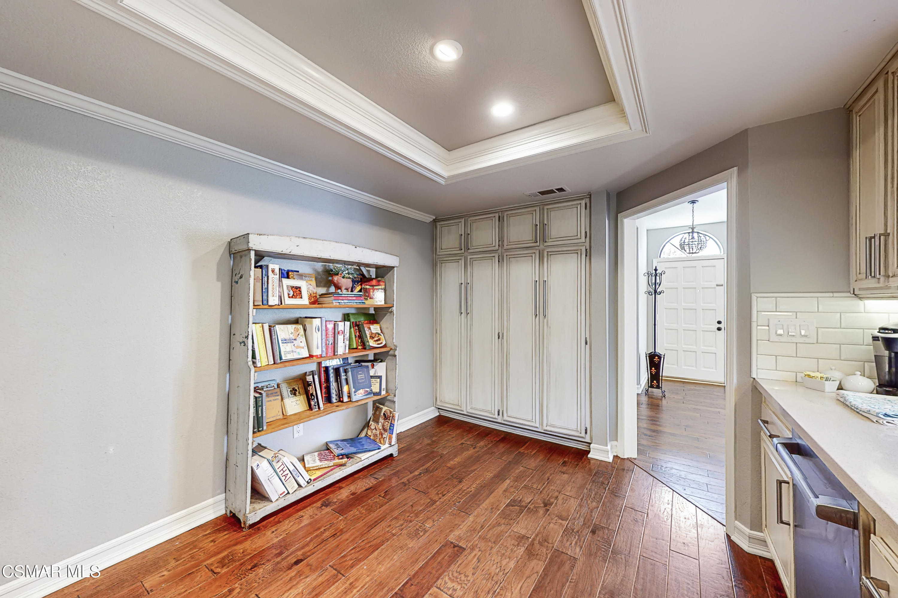 657 Cartpath Place Simi Valley, CA 93065 - Photo 10 of 50 a room with lots of wooden furniture and a book shelf