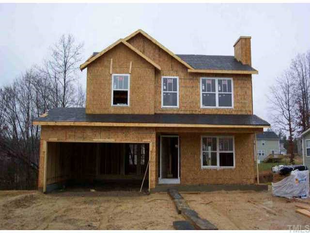 a front view of a house with a garage