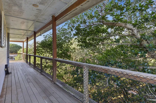 a kitchen with lots of counter top space dining table and stainless steel appliances