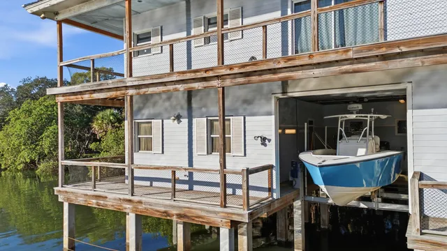 an ocean beach with lots of trees