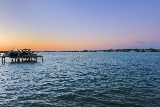 a view of ocean with sunset