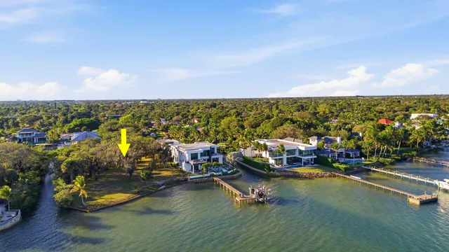 a view of a lake with boats and trees