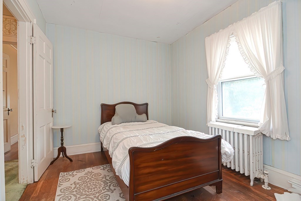 206 Concord Avenue Belmont, MA 02478 - Photo 12 of 18 a bedroom with a bed and a window
