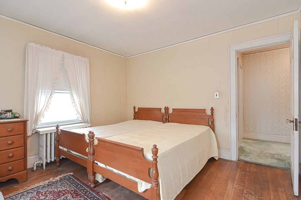 206 Concord Avenue Belmont, MA 02478 - Photo 13 of 18 a bedroom with a bed and window