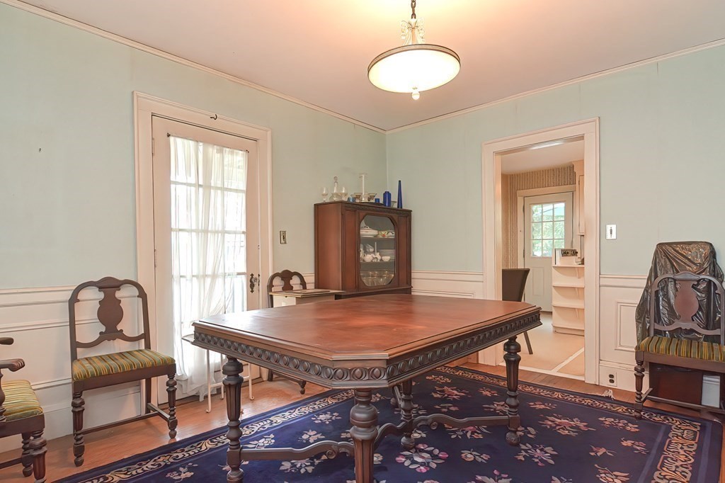 206 Concord Avenue Belmont, MA 02478 - Photo 5 of 18 a dining room with wooden floor and a chandelier