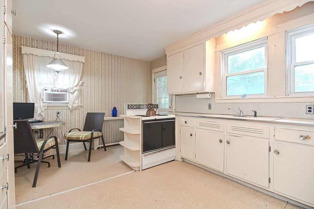 206 Concord Avenue Belmont, MA 02478 - Photo 7 of 18 a kitchen with cabinets appliances and a window