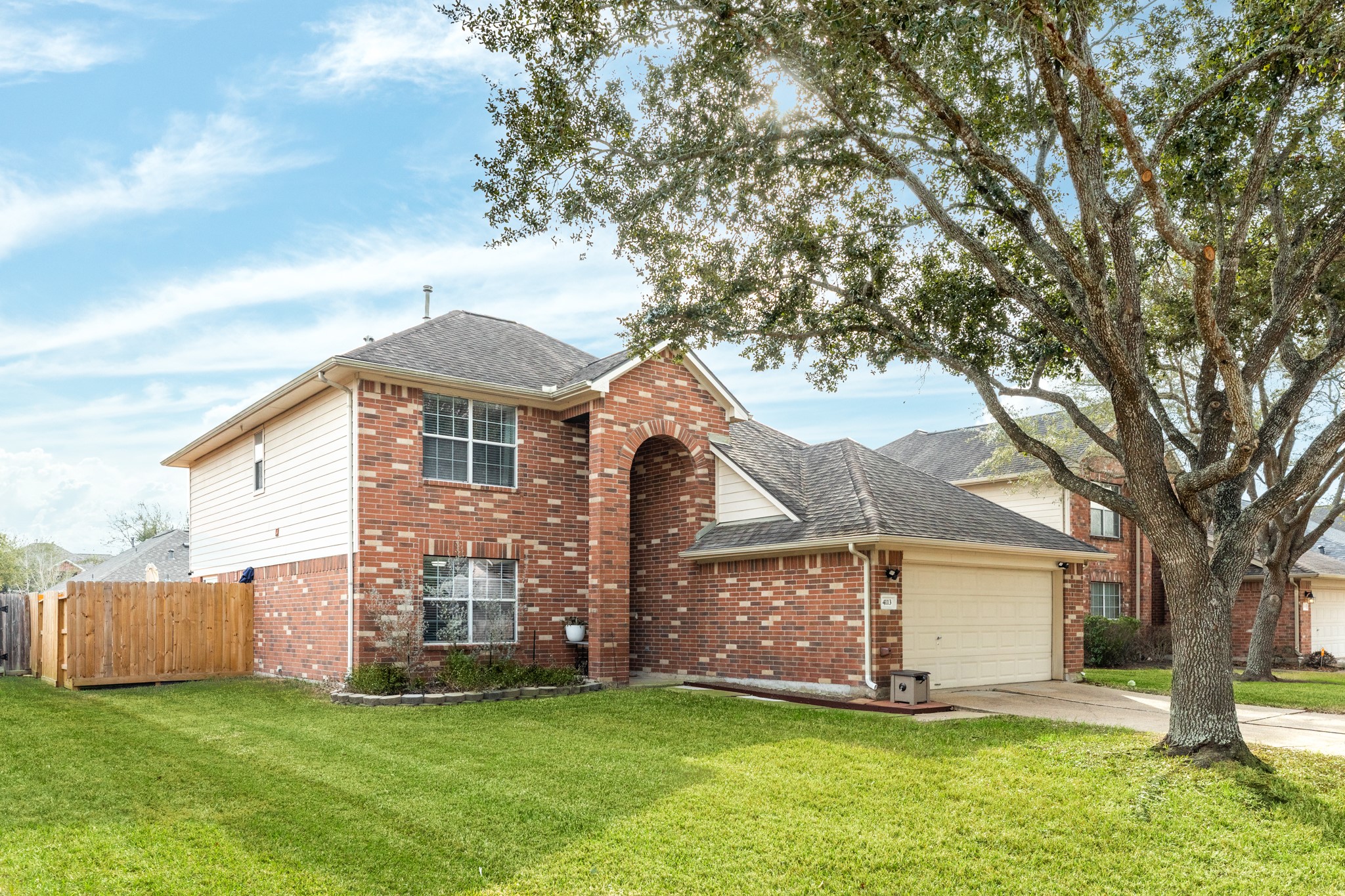 4113 Merlet Drive Pearland, TX 77584 - Photo 33 of 36 Side view highlighting the attractive brickwork at the property's facade.