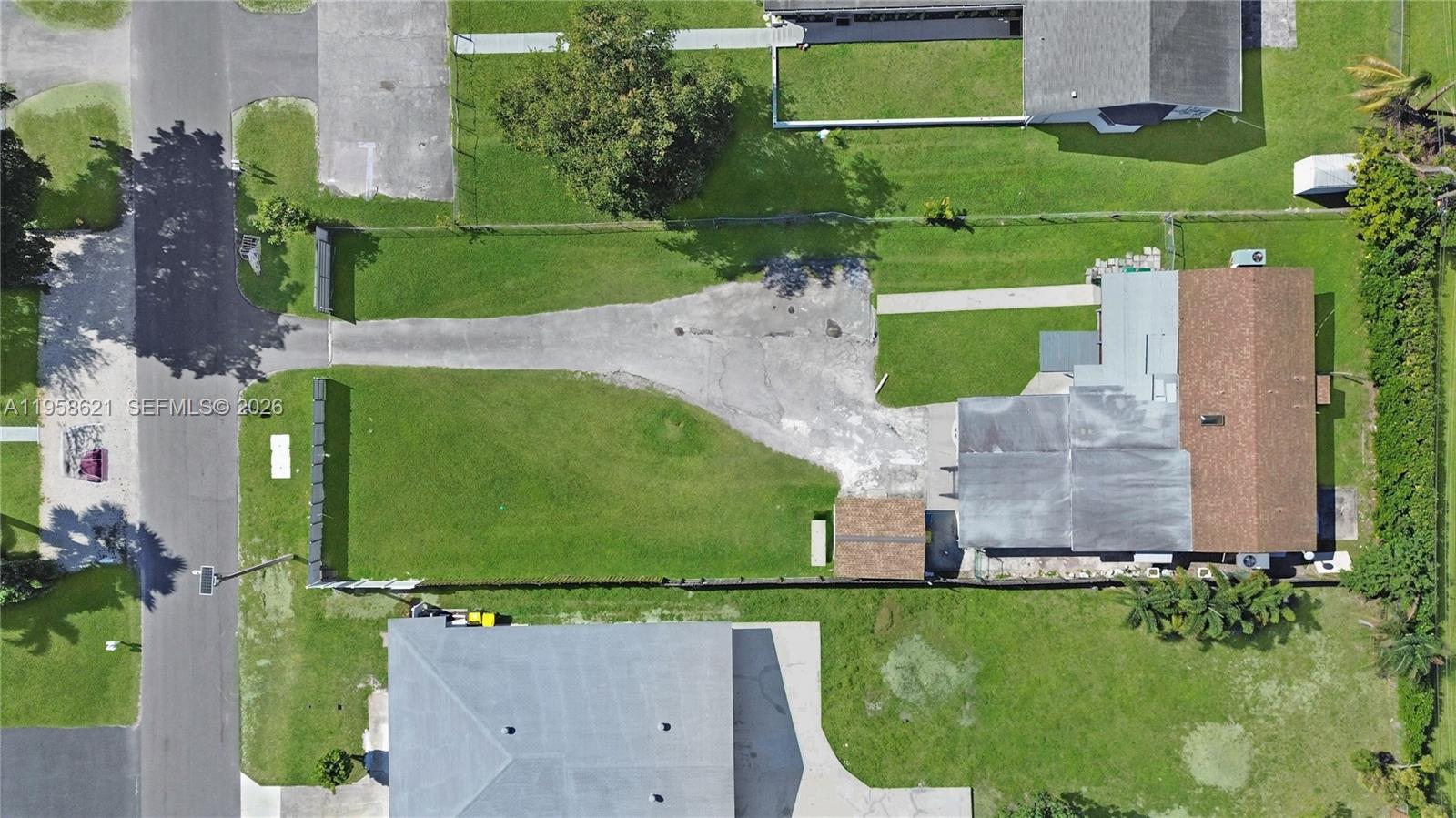 4133 SW 52nd St: aerial photograph of the existing duplex and lot