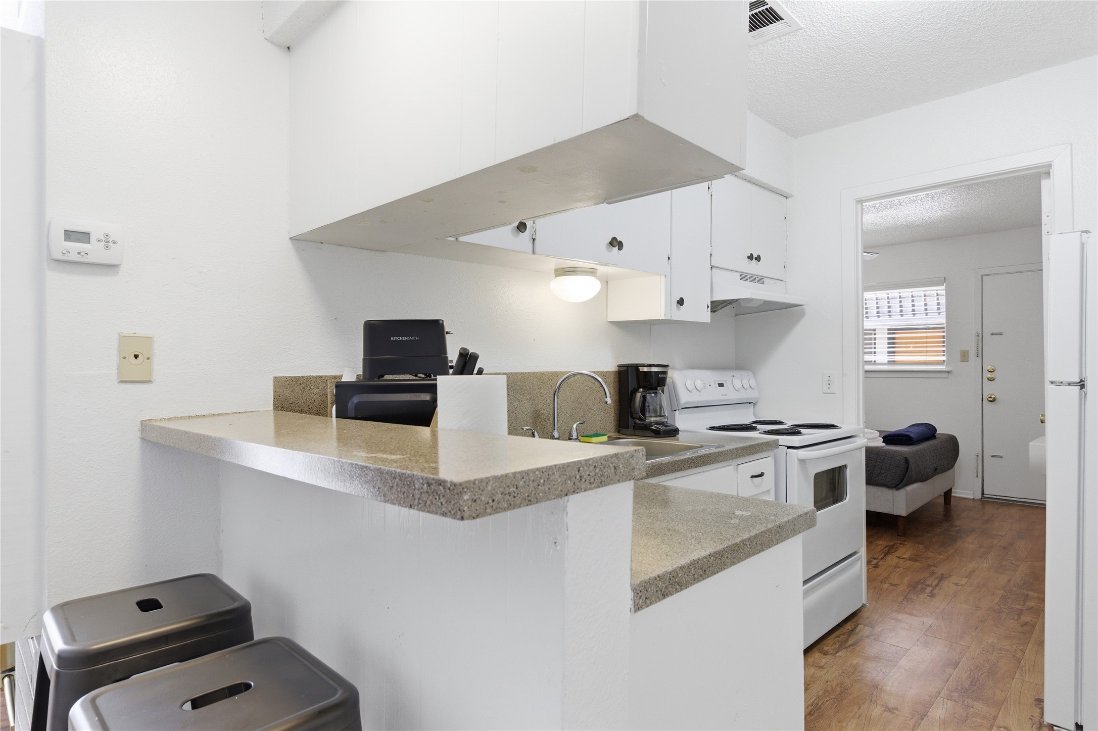 2808 Whitis Avenue, Unit C301 Austin, TX 78705 - Photo 7 of 12 a kitchen with stainless steel appliances a stove a sink and a refrigerator