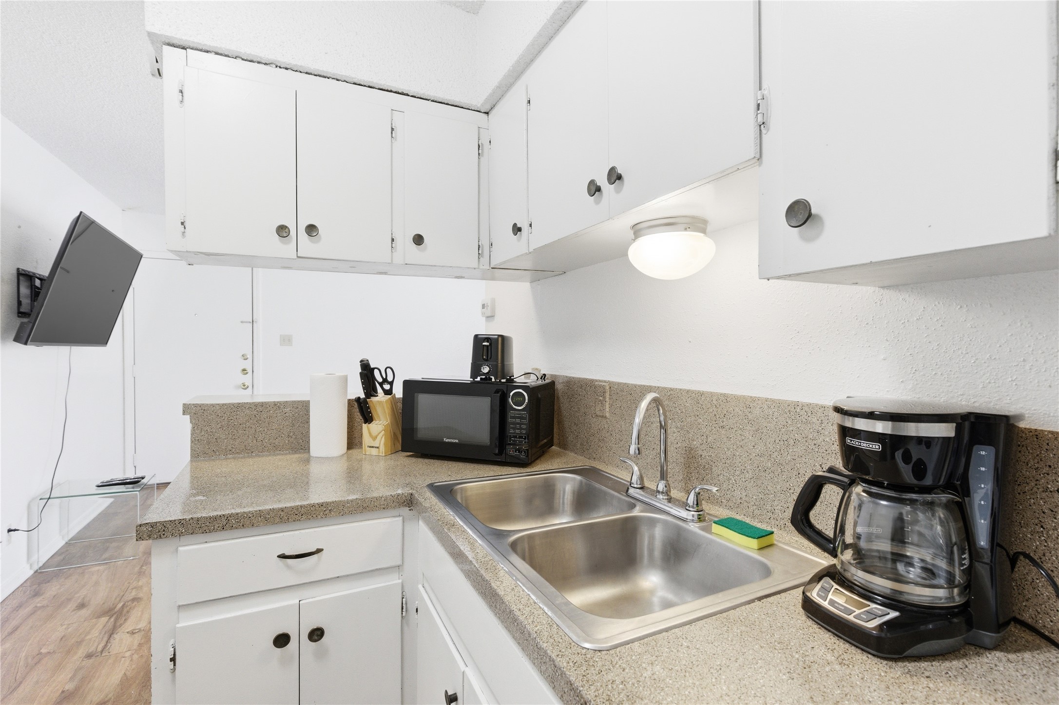 2808 Whitis Avenue, Unit C301 Austin, TX 78705 - Photo 8 of 12 a kitchen with stainless steel appliances granite countertop a sink and a white cabinets
