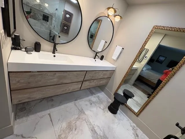 a bathroom with a sink and a mirror