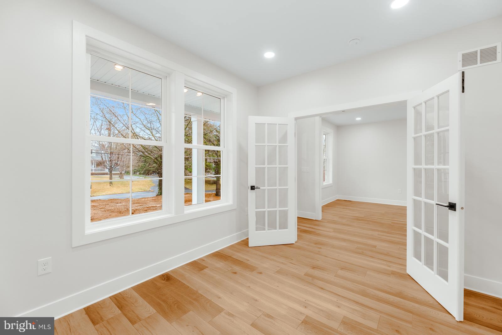 866 Hulmeville Road Langhorne, PA 19047 - Photo 11 of 63 a view of a bedroom with wooden floor and windows