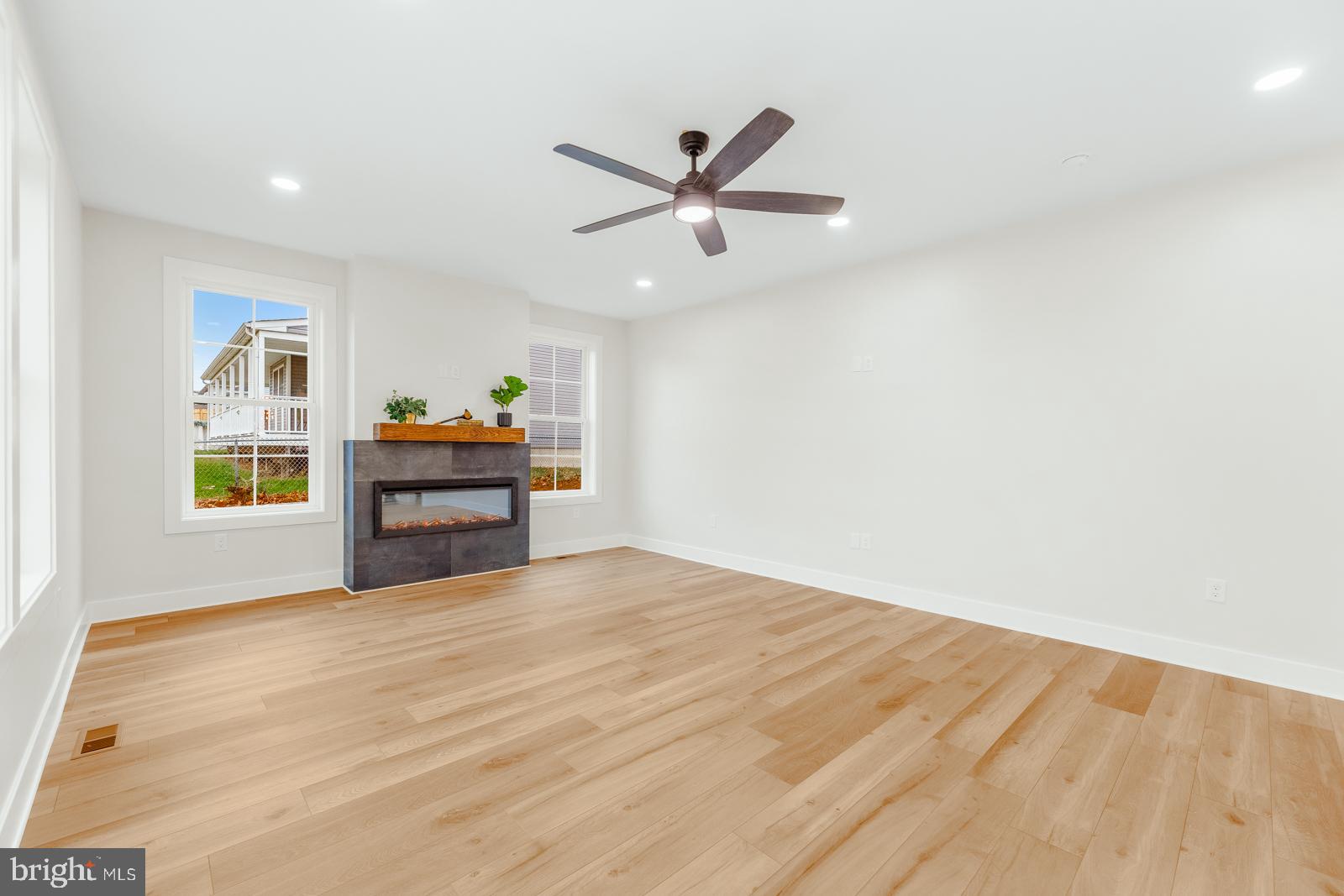 866 Hulmeville Road Langhorne, PA 19047 - Photo 13 of 63 a view of an empty room with window and wooden floor