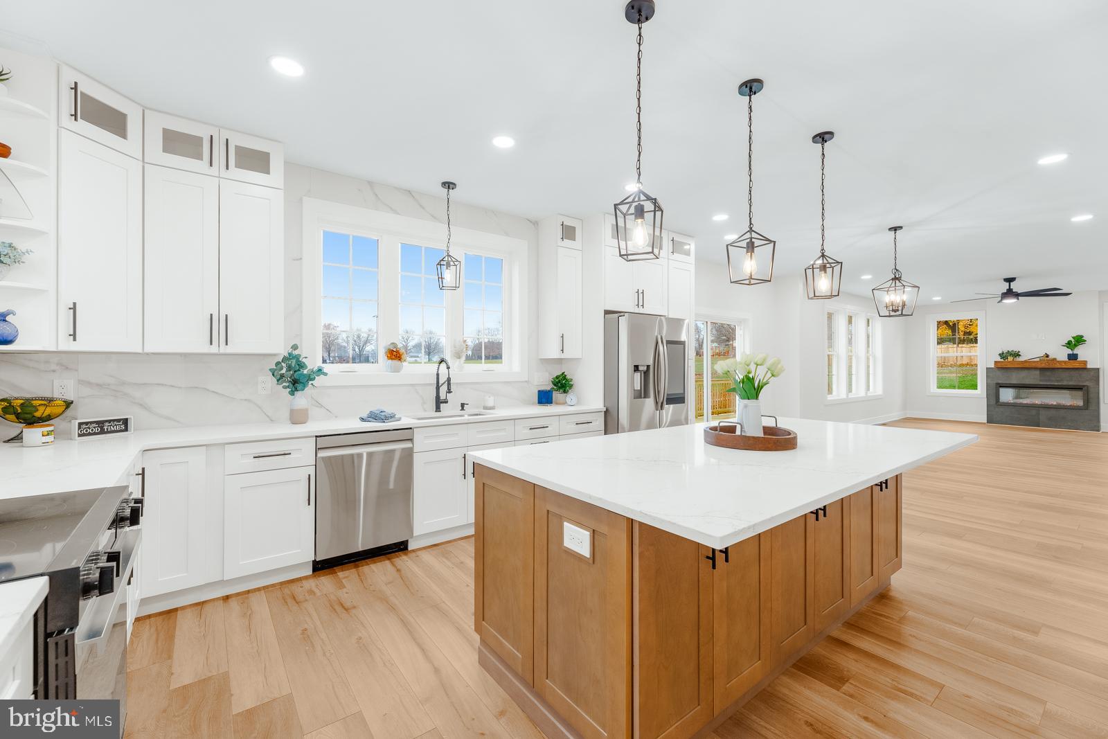 866 Hulmeville Road Langhorne, PA 19047 - Photo 23 of 63 a kitchen with kitchen island a sink stove and wooden floor