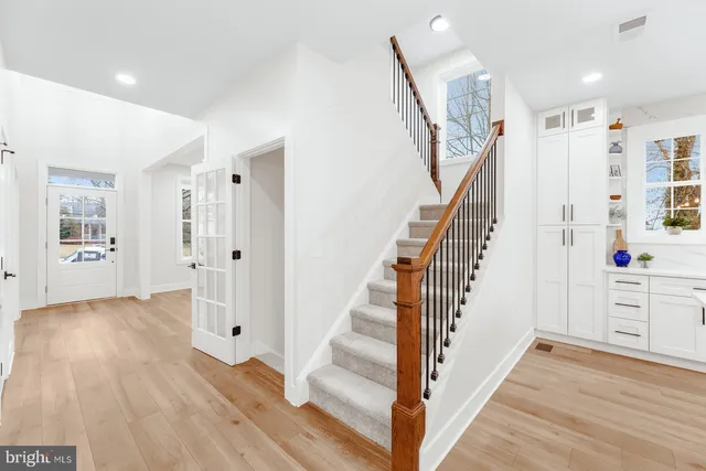 an empty room with a empty space and windows