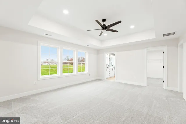a bathroom with a double vanity sink mirror and bathtub