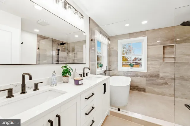 an empty room with windows and mirror