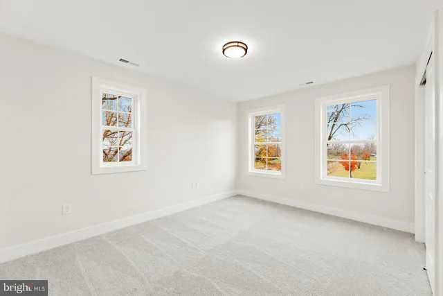 a bathroom with a sink toilet and a mirror