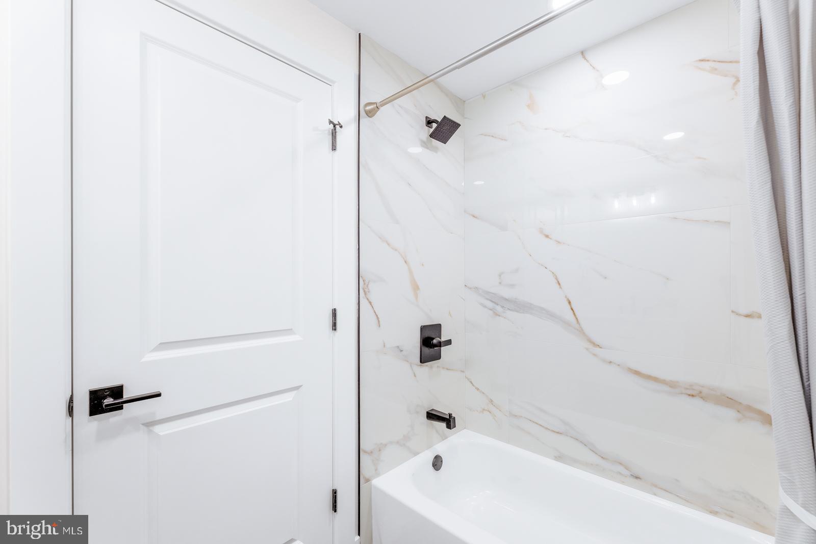 866 Hulmeville Road Langhorne, PA 19047 - Photo 55 of 63 a bathroom with a bathtub and a shower