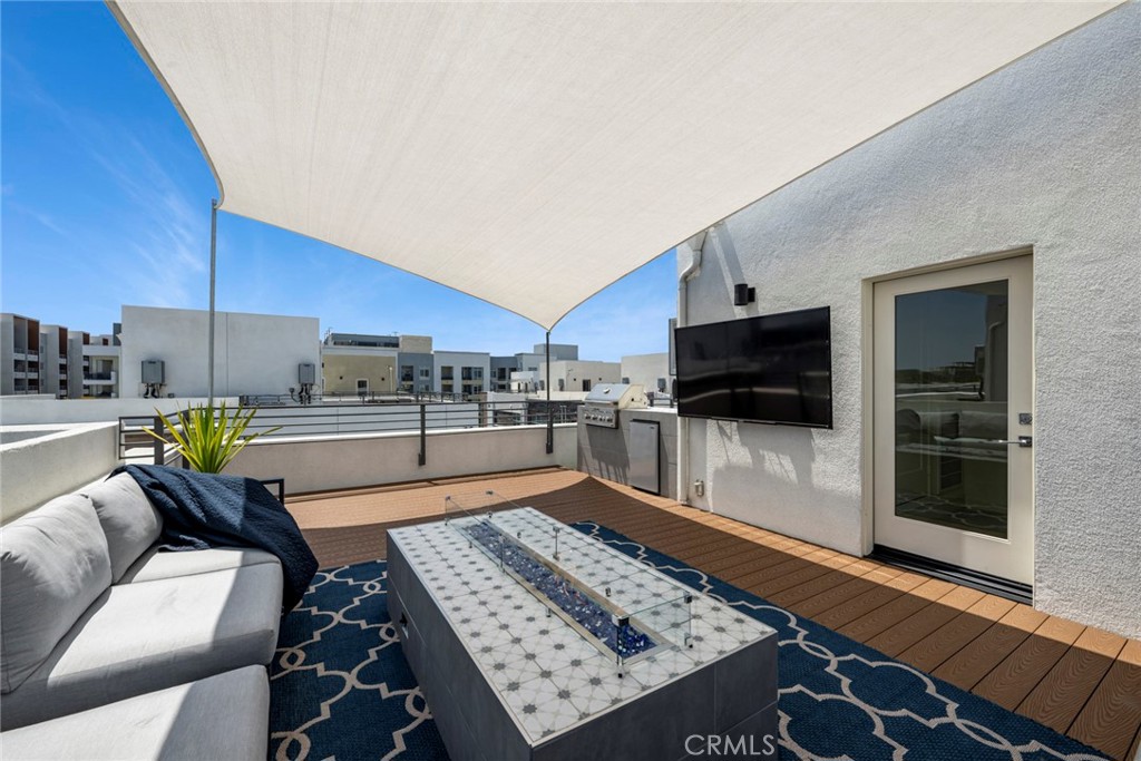 Roof top deck with firepit, tv and built in BBQ