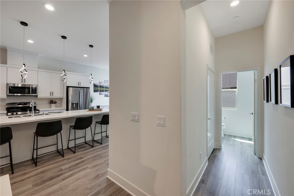 987 East Mason Lane, Unit 130 Anaheim, CA 92805 - Photo 11 of 48 Upstairs laundry area and half bath