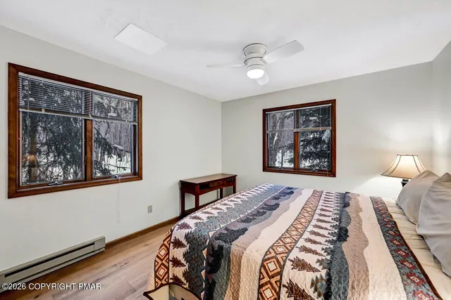 a bedroom with a large bed and a window