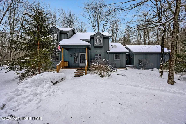 a view of a car park in front of house