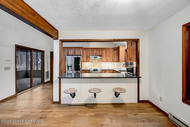 a view of room with wooden floor