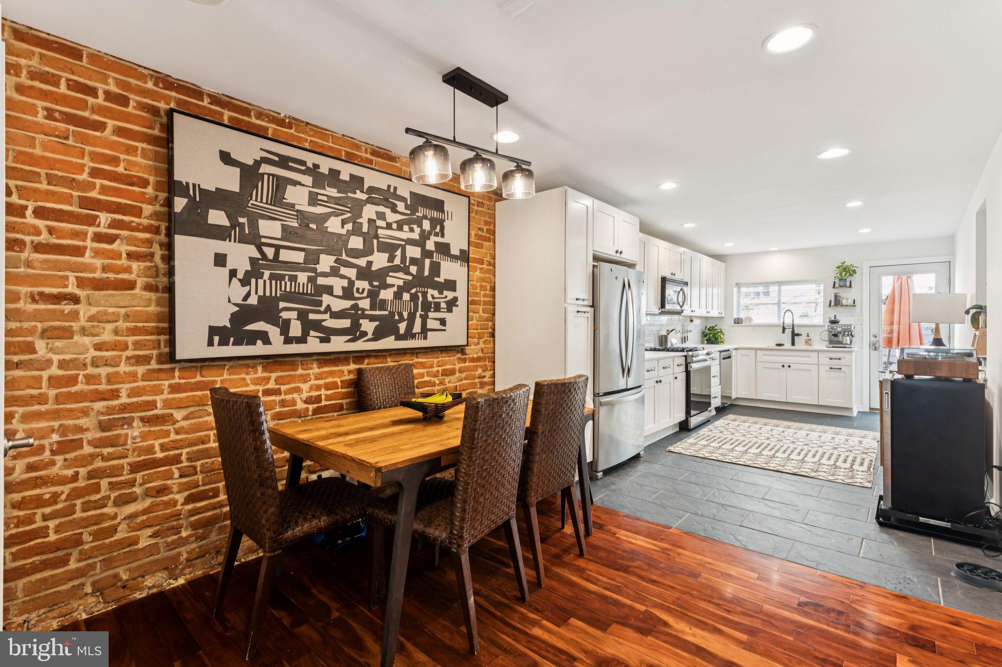 3005 Poplar Street Philadelphia, PA 19130 - Photo 12 of 53 a view of a dining room with furniture and wooden floor