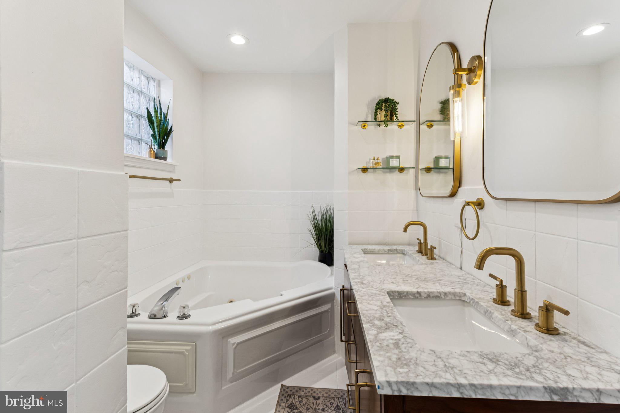 3005 Poplar Street Philadelphia, PA 19130 - Photo 24 of 53 a bathroom with a sink and a mirror