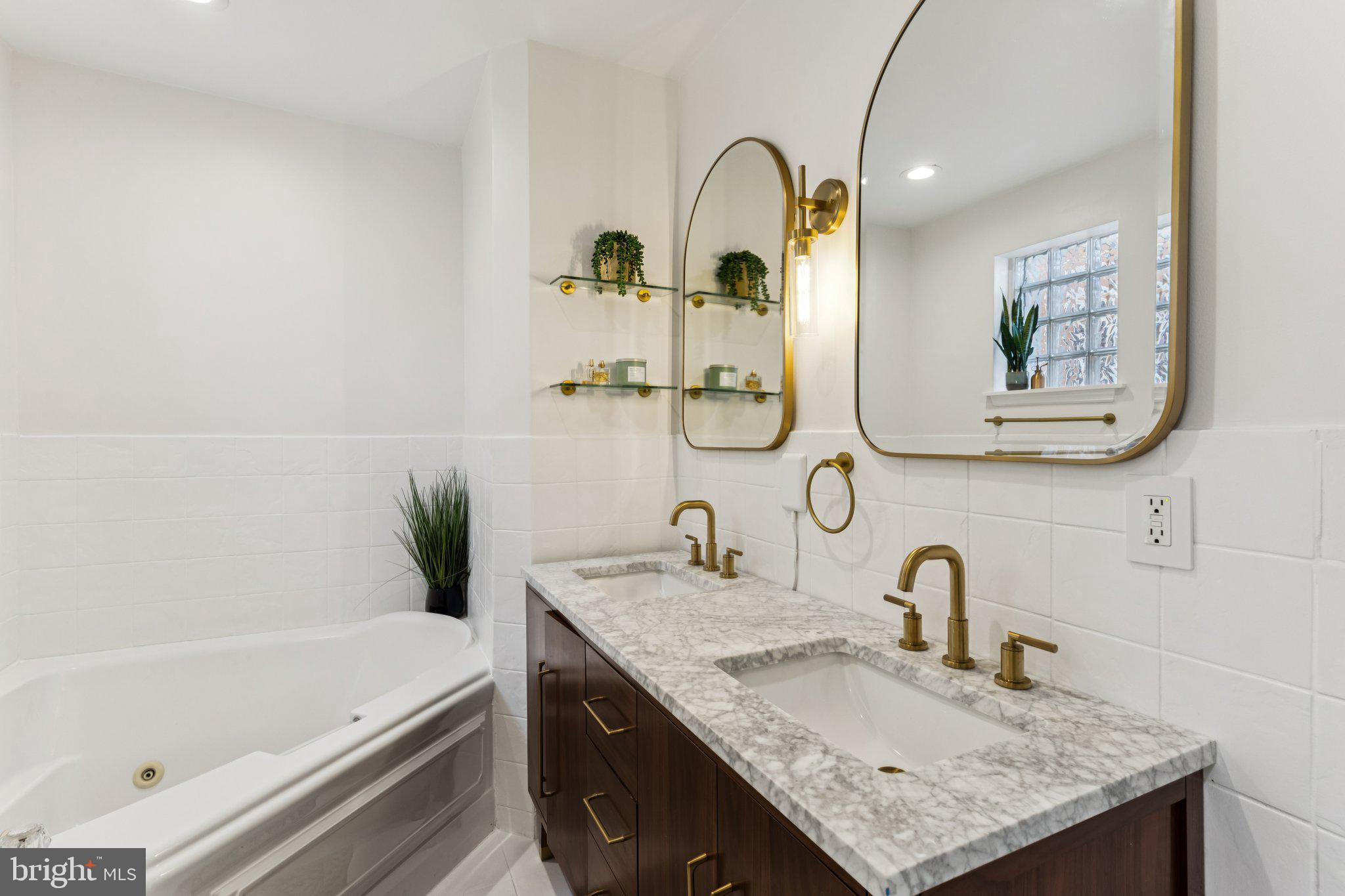 3005 Poplar Street Philadelphia, PA 19130 - Photo 25 of 53 a bathroom with a granite countertop sink and a mirror