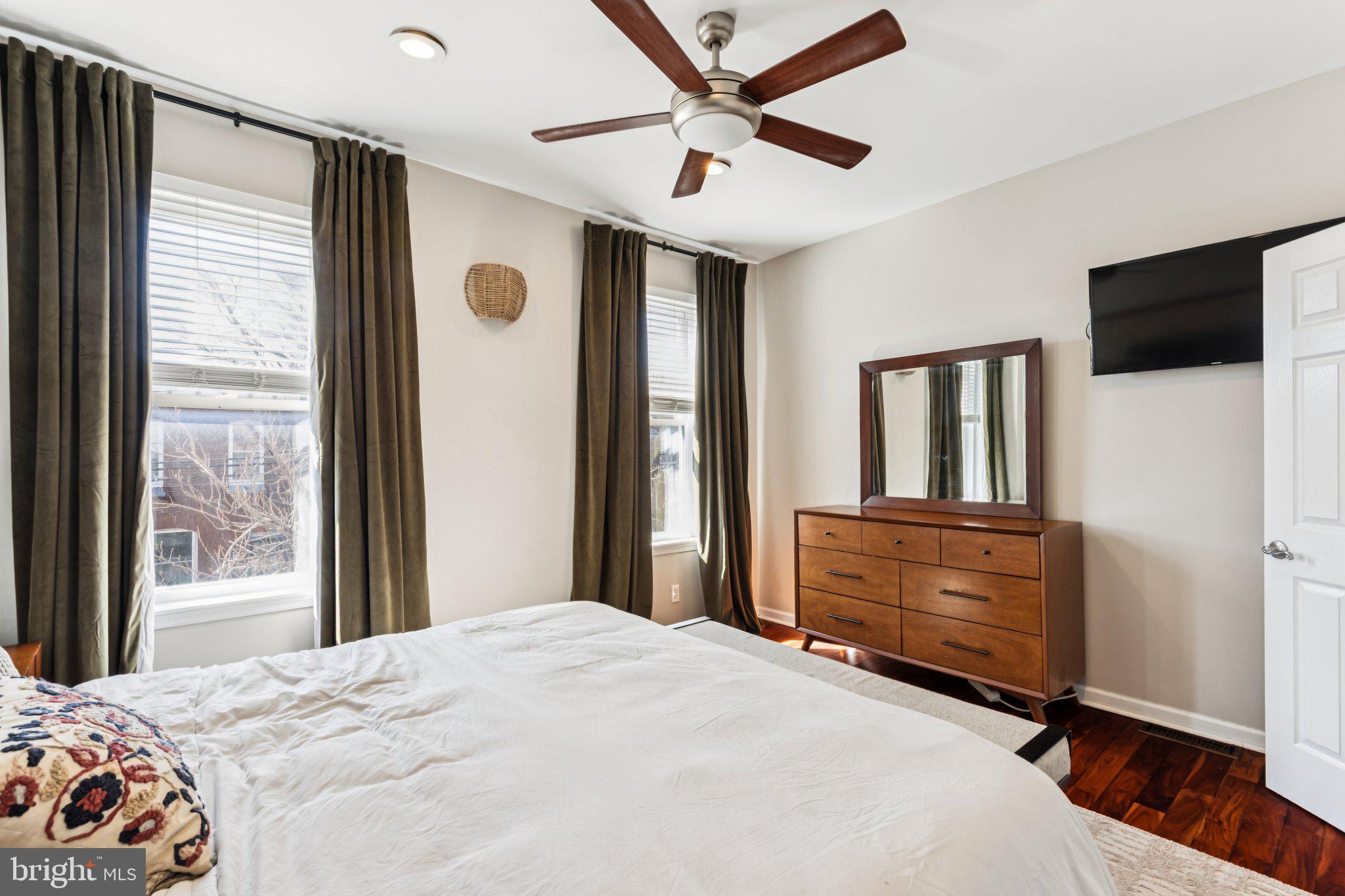 3005 Poplar Street Philadelphia, PA 19130 - Photo 30 of 53 a bedroom with a bed dresser and a window
