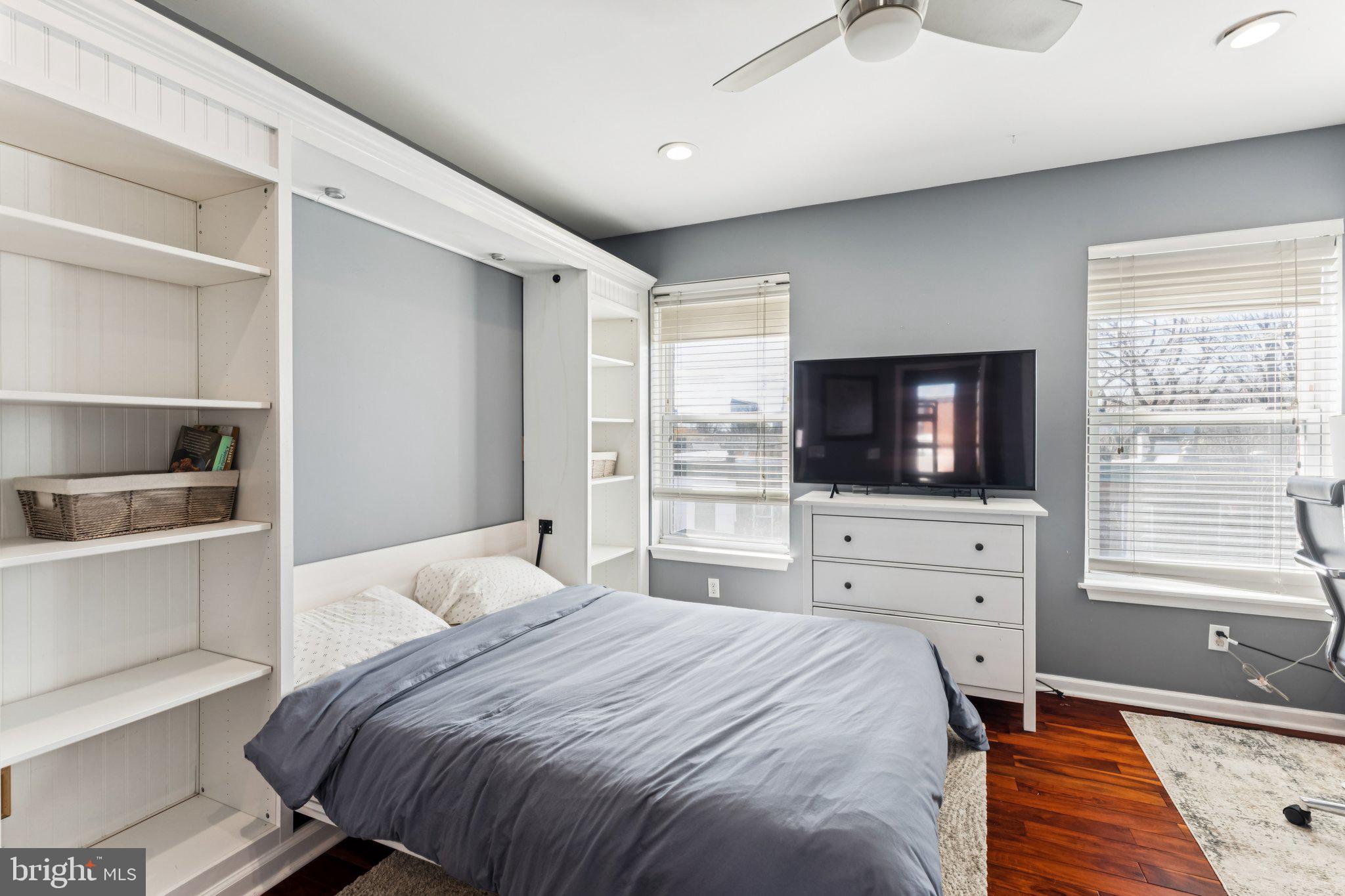 3005 Poplar Street Philadelphia, PA 19130 - Photo 33 of 53 a bedroom with a bed and a flat screen tv