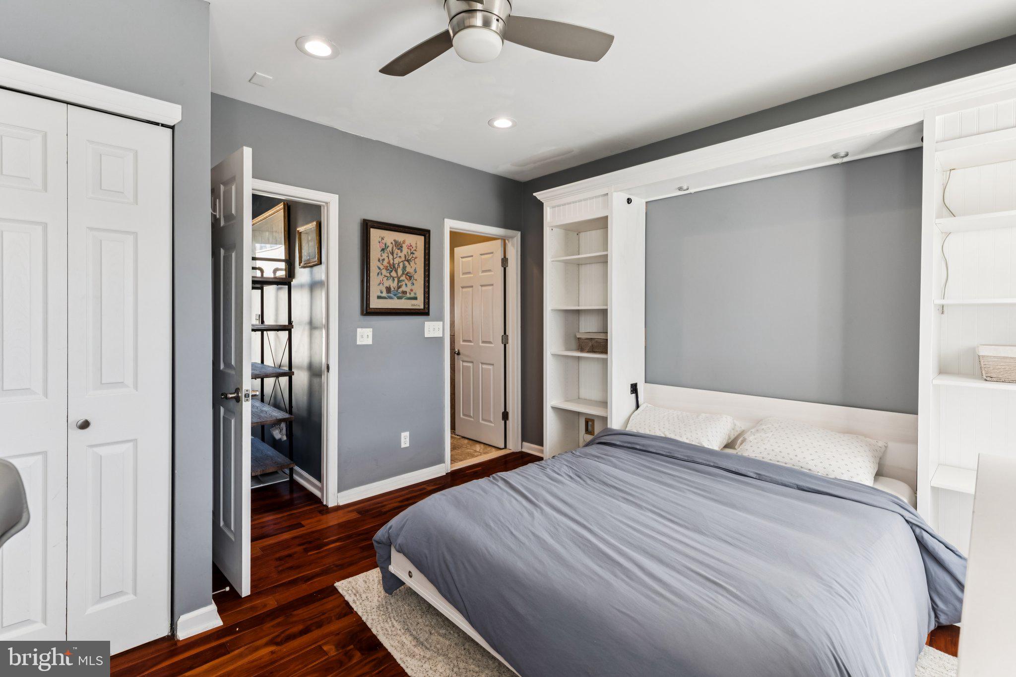 3005 Poplar Street Philadelphia, PA 19130 - Photo 34 of 53 a bedroom with a large bed and a chandelier