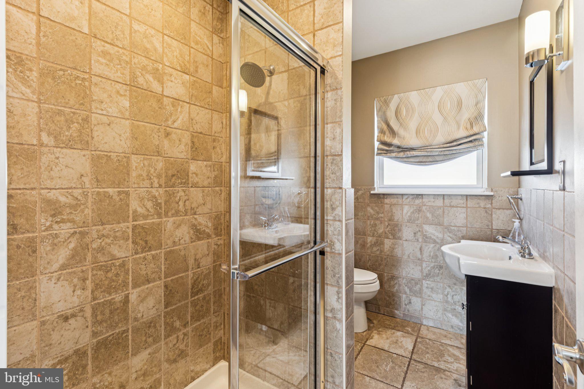 3005 Poplar Street Philadelphia, PA 19130 - Photo 36 of 53 a bathroom with a shower and a sink