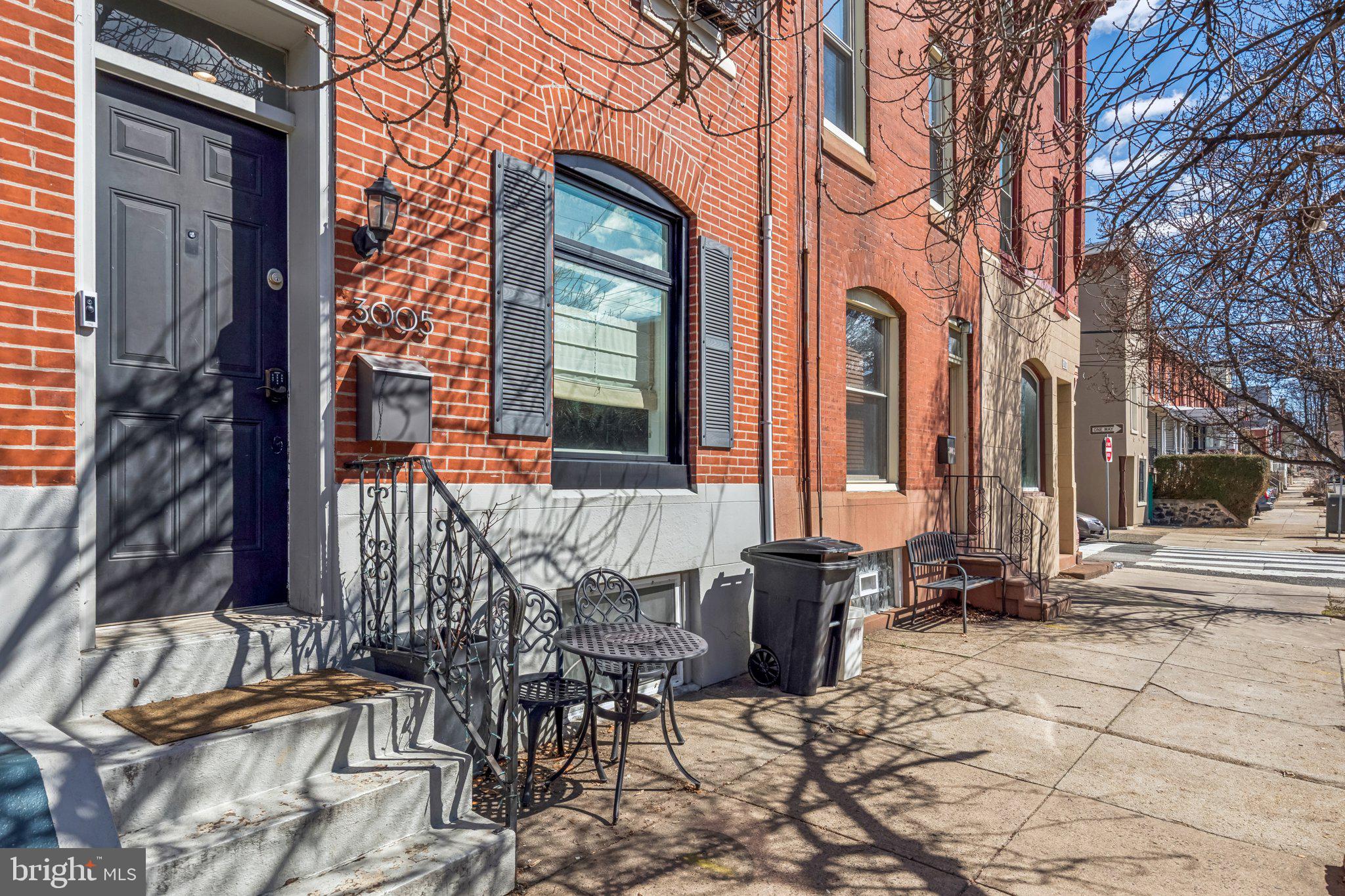 3005 Poplar Street Philadelphia, PA 19130 - Photo 5 of 53 a front view of a building with outdoor seating