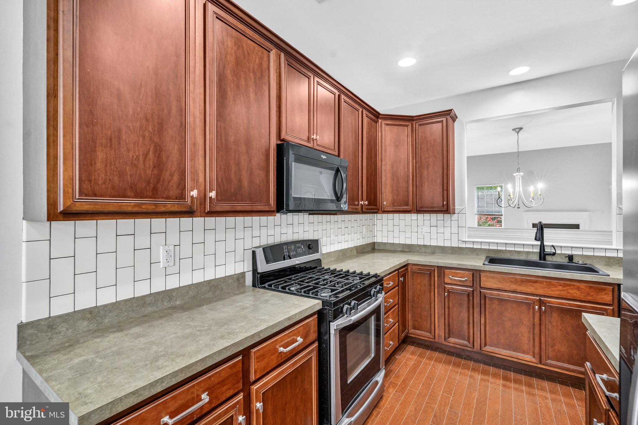 161 Stoyer Road Coatesville, PA 19320 - Photo 9 of 52 Modern kitchen with rich wood accents.