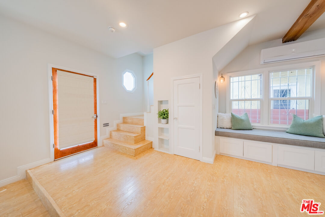 1251 South Muirfield Road Los Angeles, CA 90019 - Photo 15 of 24 a view of an empty room with a fireplace