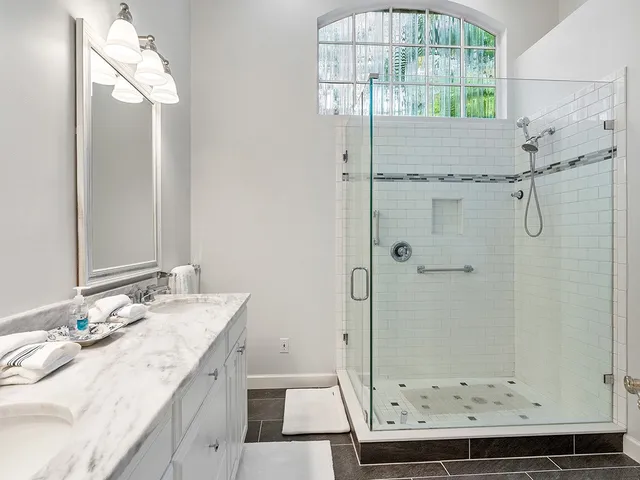 a bedroom with two beds and a window